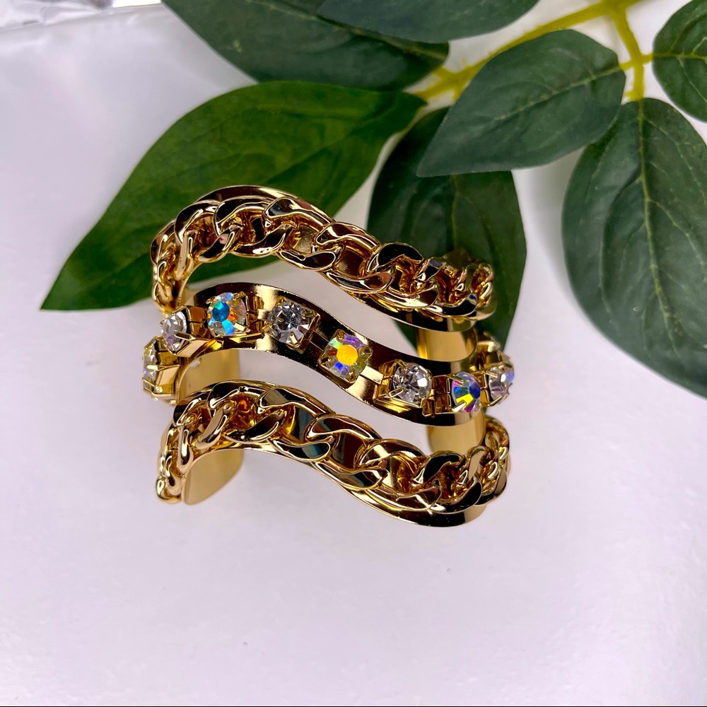 Body rhythm faux gold closable bracket with change and faux gem designs
